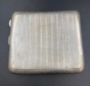 A silver cigarette case, hallmarked for Birmingham 1918 by William Neale & Son Ltd