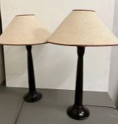A pair of wooden minimalist table lamps