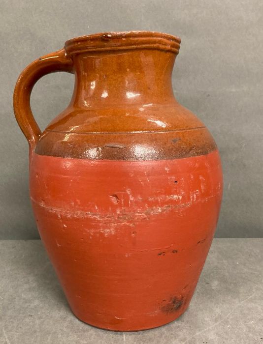A large terracotta pitcher