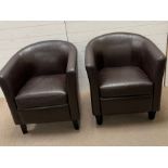 A pair of faux leather tub chairs