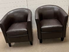 A pair of faux leather tub chairs