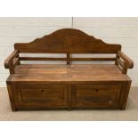 A wooden hall bench seat with drop down storage to base (H 87 cm x D 47 cm x W 132cm)