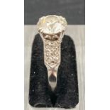 An Art Deco diamond ring, centre stone approx 1.35ct (Chip to stone) I/J colour SI1 clarity. Total