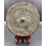 An antique Chinese bronze mirror (approx. Dia13.5cm)