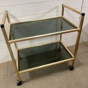 A Mid Century smoked glass drinks trolly