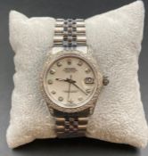 Rolex Oyster Perpetual Datejust with diamond bezel, numbers and surround