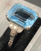 An aquamarine and diamond ring set on a platinum shank, central stone is approx 3 cts. with