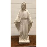 A religious statue of Jesus, sculpted in flowing robes and outstretched hands AF (H84cm)