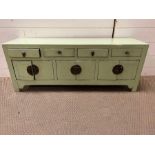 An oriental style four drawer cabinet 102cm L x 28cm D x H40cm