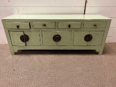 An oriental style four drawer cabinet 102cm L x 28cm D x H40cm