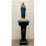 A religious Holy statue of Mary fixed on a wooden plinth (H160cm W40cm D26cm)