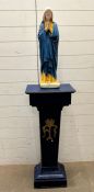 A religious Holy statue of Mary fixed on a wooden plinth (H160cm W40cm D26cm)