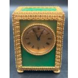 A French Hour Lavigne travel alarm clock with green panels
