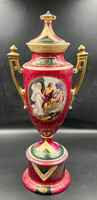 A gilt porcelain covered vase with painted scenes to side