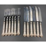 A set of six dessert knives and forks, silver handled marked for Sheffield 1970 makers mark HB for