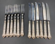 A set of six dessert knives and forks, silver handled marked for Sheffield 1970 makers mark HB for