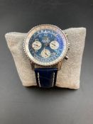 A Breitling Chronometer Navitimer A23322 with Blue face and blue leather strap.