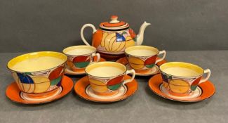 A Clarice Cliff Fantasque pattern tea service to include teapot, four cups, five saucers and a sugar