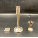 Three hallmarked silver items to include a pill box, toothpick umbrella and a single stem vase