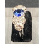 A sapphire and diamond ring, Sapphire stone is approx 0.80cts (Size N1/2)