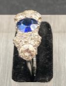 A sapphire and diamond ring, Sapphire stone is approx 0.80cts (Size N1/2)