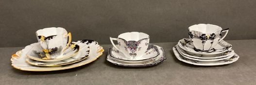 A selection of Art Deco style Shelly ceramics to include a trio of Queen Anne, shape black leaf tree