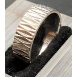 A diamond cut platinum wedding band (6.9g) (Size N)