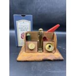 A brass seal set with stamper and wax in a desk top display