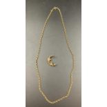 A 9ct gold chain with a crescent moon brooch with seed pearl flower (16.4g)