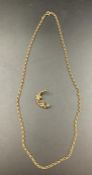 A 9ct gold chain with a crescent moon brooch with seed pearl flower (16.4g)