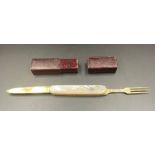 A Mother of Pearl cased silver knife and fork set portable set, in leather case, hallmarked for