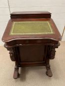 A reproduction Davenport desk with green leather top