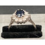 A vintage sapphire and diamond cluster ring on 18ct gold and platinum. Total sapphire weight is