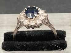 A vintage sapphire and diamond cluster ring on 18ct gold and platinum. Total sapphire weight is