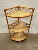 A rattan and wicker corner unit