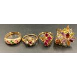 Four 14ct gold rings, various Harlequin stone settings (14.1g)