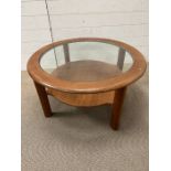 A vintage G-Plan circular glass top coffee table (H42cm Dia84cm)