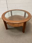 A vintage G-Plan circular glass top coffee table (H42cm Dia84cm)