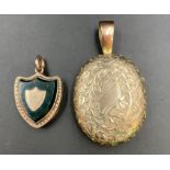 Two silver lockets, one shield shaped