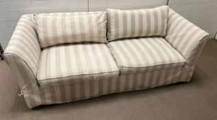 A large two seater sofa with striped loose covers (H72cm W207cm D90cm SH42cm)