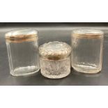 Three Silver topped glass jars