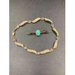 A 9ct gold and turquoise stone brooch and an AF 9ct gold bracelet. (Approximate Total weight 6.7g)