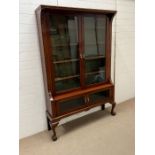 A double glazed cabinet with glazed cupboard to base on ball claw front feet (H193cm W127cm D31cm)