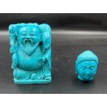 A turquoise laughing Buddha and head