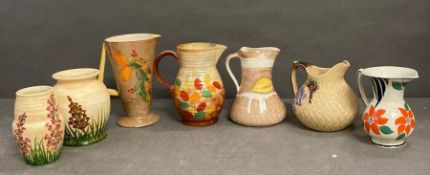 A selection of jugs, ewer and vases, various makers and marks