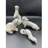 Four white porcelain animals