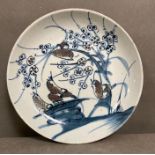 A Chinese Qing Jiaqing blue and white plate with birds in copper red (Dia23.5cm)