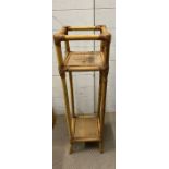 A bamboo and wicker plant stand