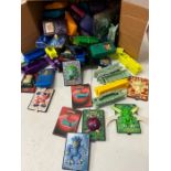 A selection of Pokemon toys, cards and Gameboy kids meal toys