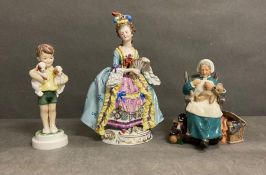Three porcelain figures to include Royal Worcester "Boy with poppies" Royal Doulton "Nanny" and lady